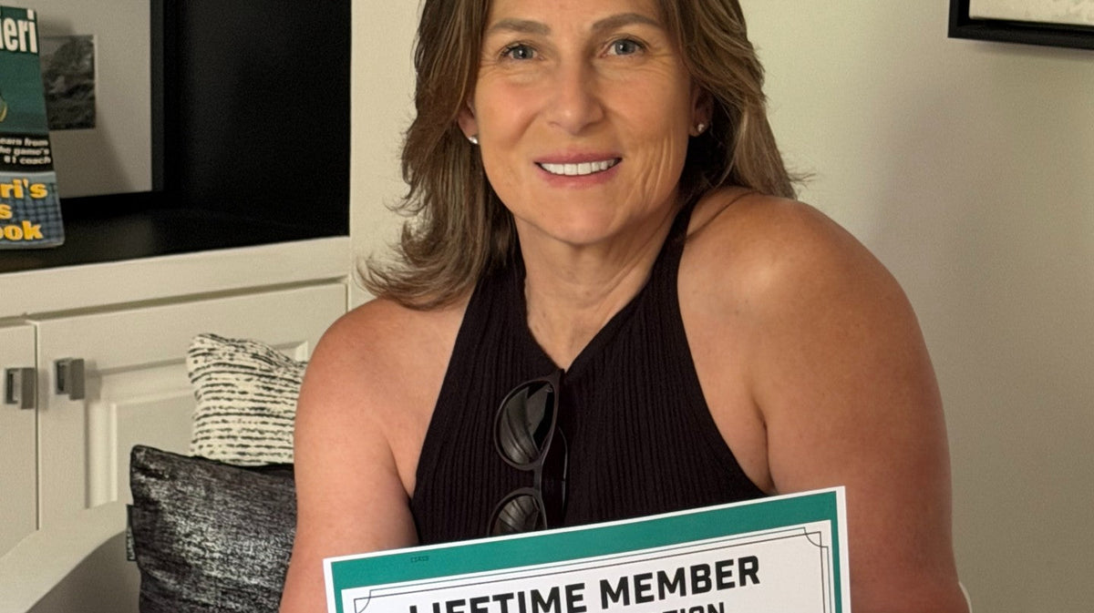Simona Moore holding a Women in Motorsports North America lifetime member certificate