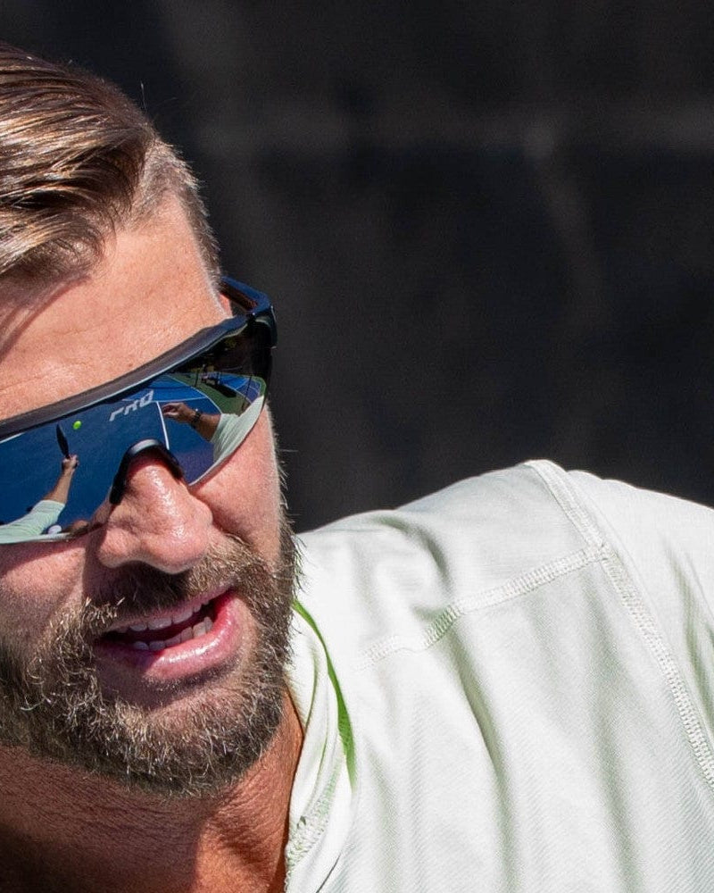 Player wearing PBPRO polarized sunglasses designed for outdoor pickleball and sports performance.
