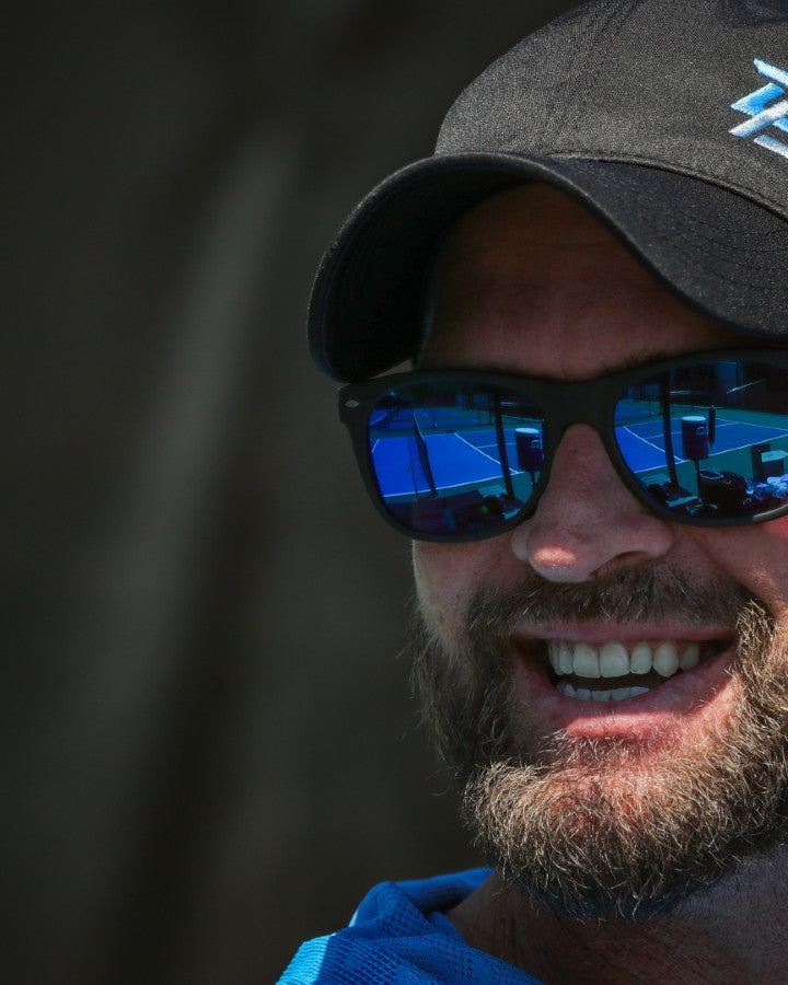 Male pickleball player wearing a PBPRO performance hat and sunglasses.