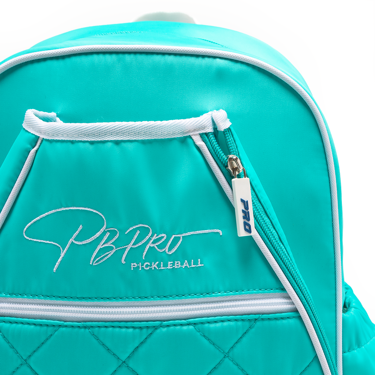 Mint PBPRO Signature pickleball backpack, close-up of front logo and zippers