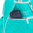 Mint PBPRO Signature pickleball backpack, close-up of front pocket holding a phone
